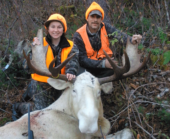 Happy moose hunter and her uncle after she shot this albino moose in Vermont Wildlife Management Unit E1 during the Vermont 2010 moose season - Click for larger image A happy and successful moose hunter who stayed at Jackson's Lodge poses with her uncle and an albino moose